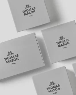 Clean minimal and seamless soft grey packaging with black semi-gloss embossed black logo. 