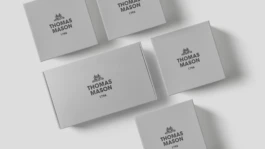Clean minimal and seamless soft grey packaging with black semi-gloss embossed black logo. 